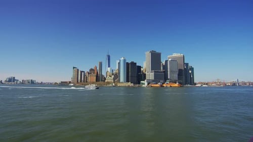 Boat sailing by Lower Manhattan, New York City