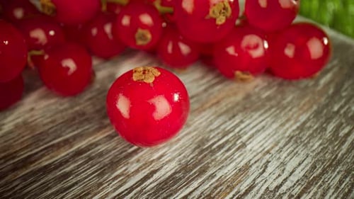 Vibrant Red Currants on Wooden Surface