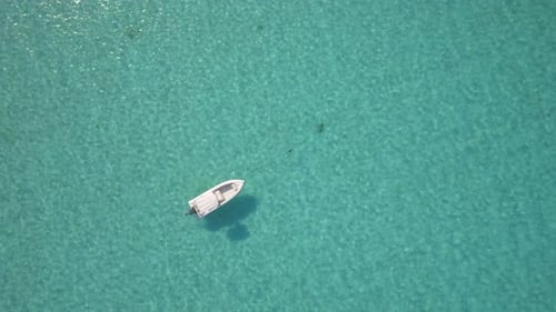 Aerial drone view of a fishing motor boat in the Bahamas, Caribbean.