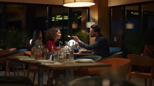 Multiracial Couple Sharing Food Dinner in Italian Restaurant on Romantic Date