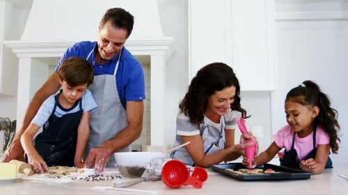 Family Enjoys Baking Cookies Together in Bright Kitchen