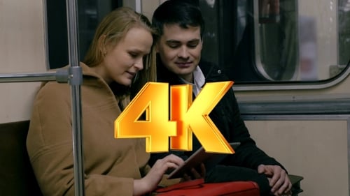 Woman and Man Using Tablet on Train
