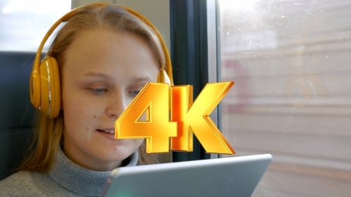Woman In Headphones Listening To Music On The Way