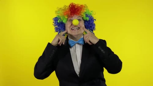 Clown Gesturing and Making Faces in Costume