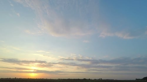 Golden Sunset Over Rural Landscape