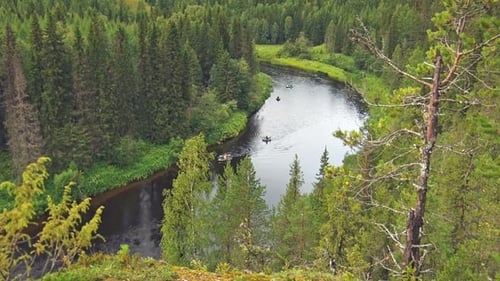 Tourists Float in Rubber Boats on the River