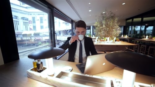 Businessman On a Break In Restaurant