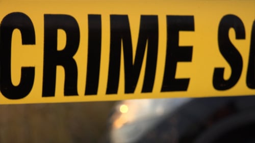Yellow Crime Scene Tape Blowing in the Wind