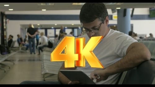 Man Using Tablet at Airport Terminal