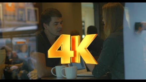 Young People Using Smart Phone And Talking In Cafe