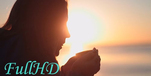 Woman Drinking A Hot Drink At Dawn