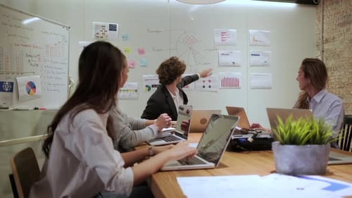 Meeting of multiracial professional teamwork with coworkers at the business office.