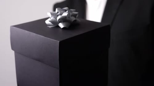 Black Gift Box Held in Hand