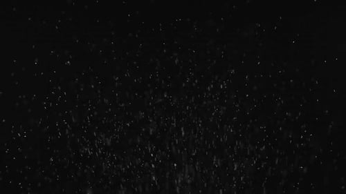 Abstract Particles Floating on Dark Background