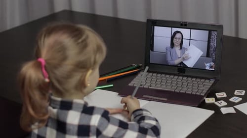 Child Learning Online at Home Using Laptop