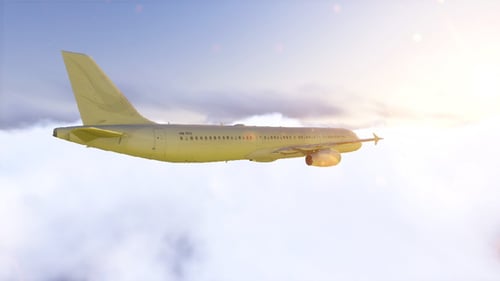 Shiny Golden Airplane Flying in Bright Cloudy Sky