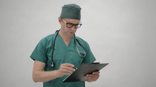 Doctor Reading Medical Report