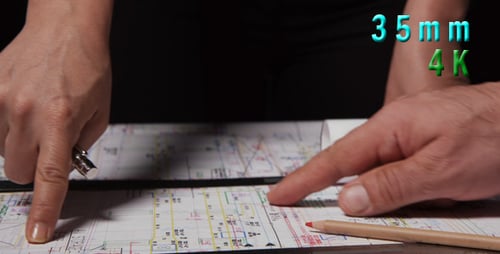 Architects Drawing Blueprint in Workplace Close Up