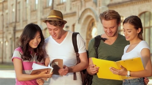 Cheerful Sudents Next To University