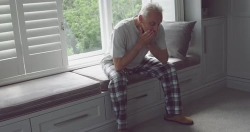 Senior man alone at home