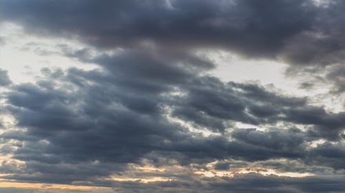 Dramatic Time Lapse of Storm Clouds at Sunset