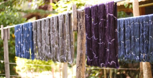 Colorful Yarn Hanging on Rack to Dry