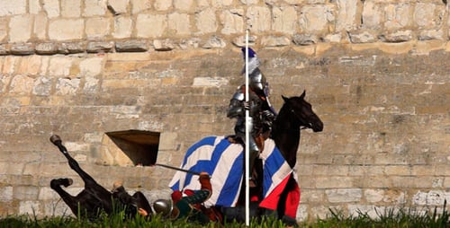 Knight in Shining Armor Atop Horse Near Stone Wall