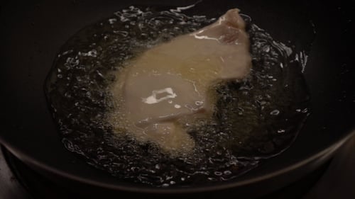 Chicken Being Deep Fried in Oil, Close Up