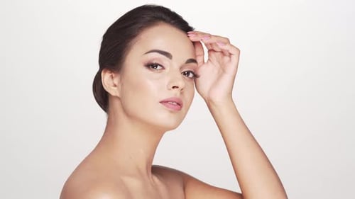 Studio portrait of young and beautiful brunette woman over