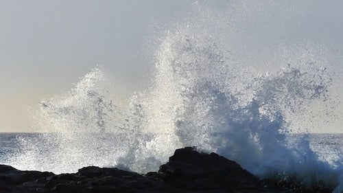 Waves Crashing on Rocky Coastline