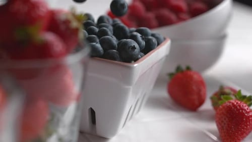 Assortment of Fresh Berries Being Prepared Indoors