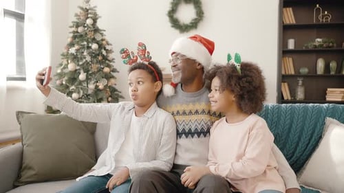 Family Celebrates Christmas with Selfie Together at Home
