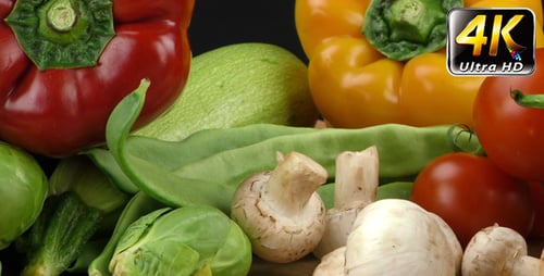 Fresh colorful vegetables displayed on wooden surface