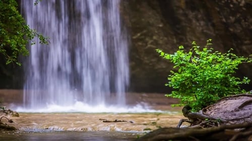 Beautiful Waterfall Falling Down In Forest