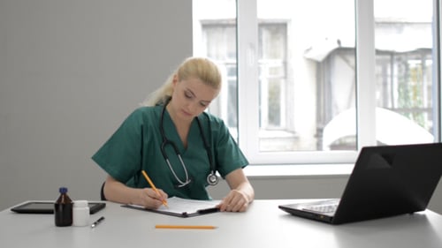 Doctor Going Through Medical Report