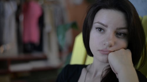Pensive Woman Indoors, Close Up