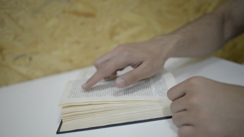 Book Pages Being Flipped and Read