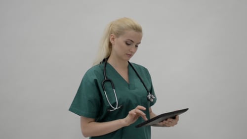 Doctor Working on Tablet PC