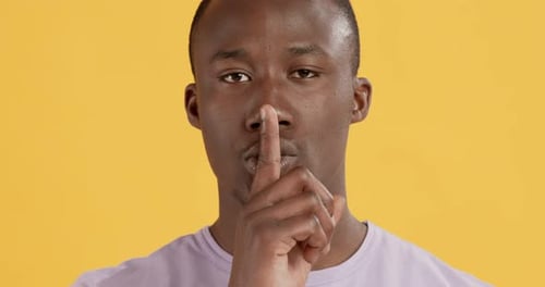 Man Gesturing for Silence, Close Up Portrait