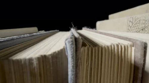 Macro of a Stack of Old Books with Gray Shabby Covers and Yellowed Pages