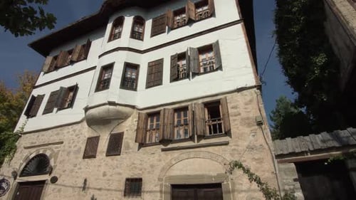 Exterior of Historical Stone Building with Wooden Shutters