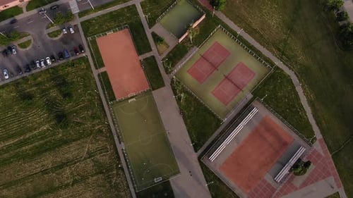 Aerial View of the City's Green Recreation Area with Many Sports Grounds for Different Games and