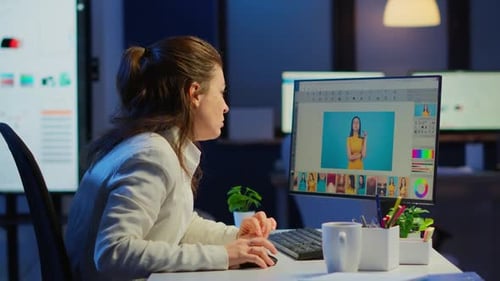 Professional Photo Retoucher Working on Project in Business Office at Night Time