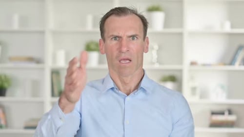 Angry Man Gesturing and Shouting Indoors