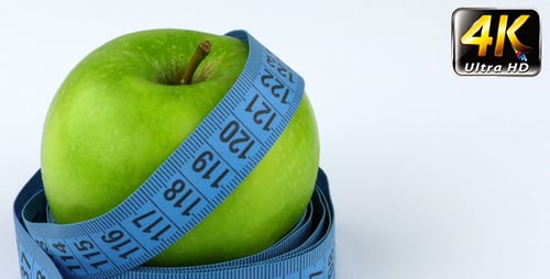 Fresh Green Apple with Measuring Tape Close Up