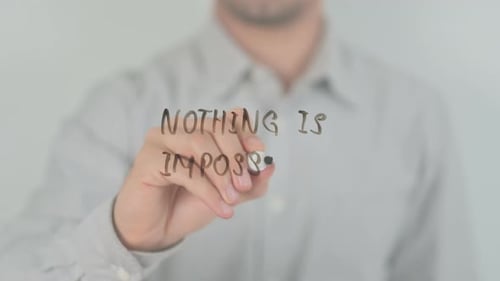 Hand Writes 'Nothing is Impossible' Message