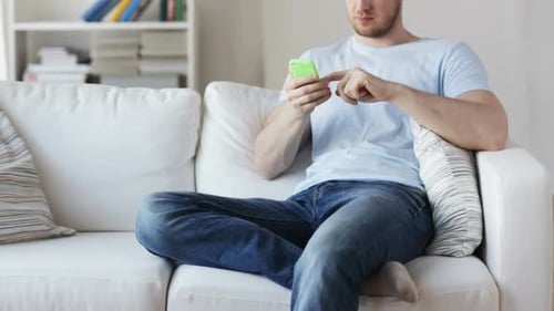 Close Up Of Man With Smartphone Texting At Home 1