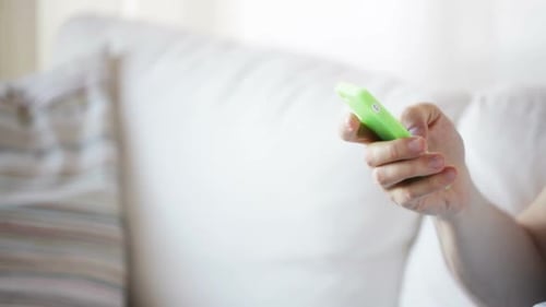 Close Up Of Man With Smartphone Texting At Home 3