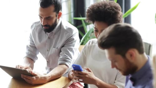 Friends With Smartphone And Tablet Pc In Office 3