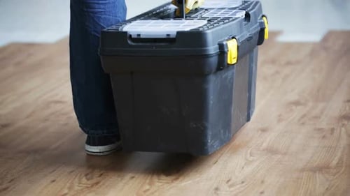 Close Up Of Man Carrying Tool Box And Leaving It 4